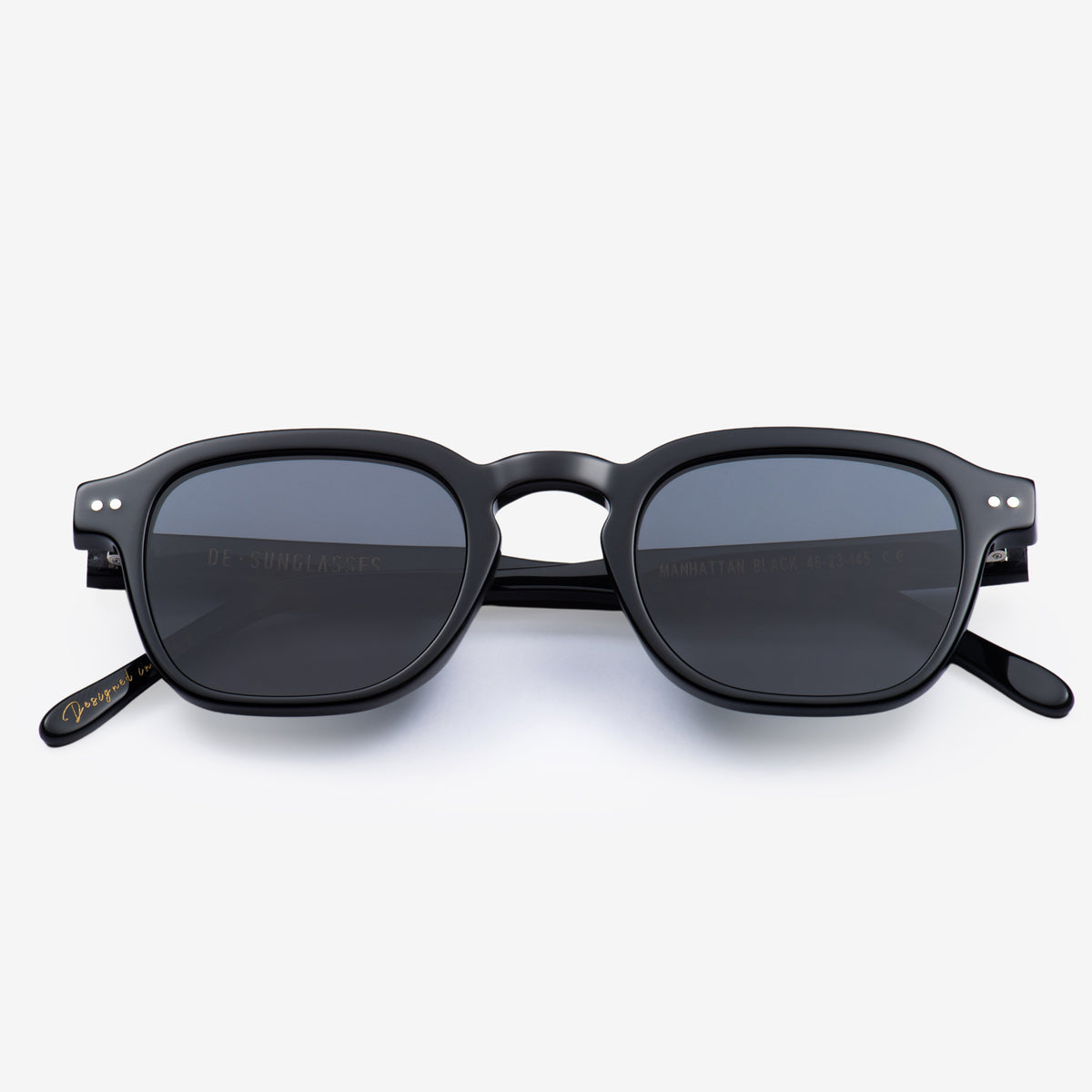 a pair of black scissors sitting on top of a table