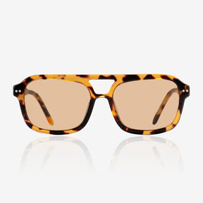 a pair of glasses sitting on top of a white table 