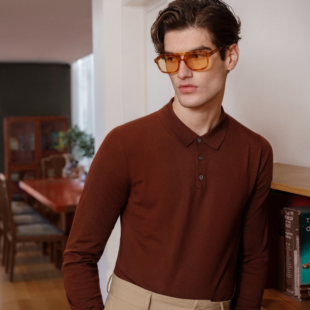 a man in a red shirt and sunglasses 