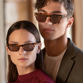a man and a woman with glasses on 